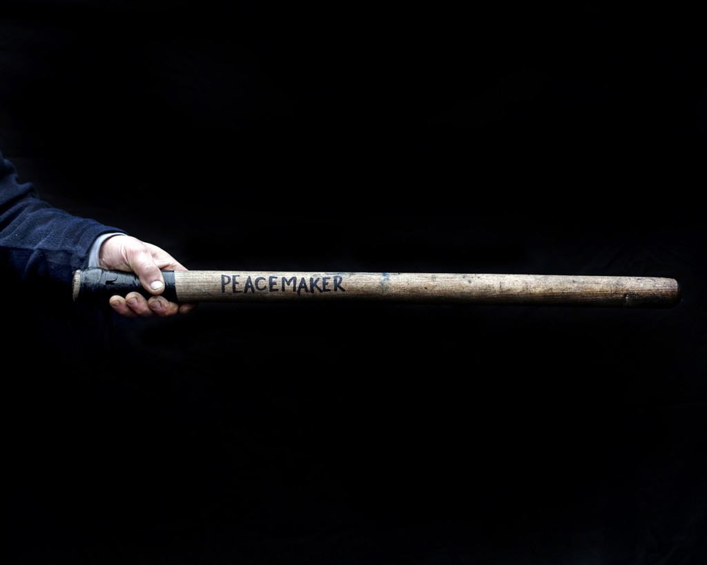 A baton with the inscription 'PEACEMAKER'.